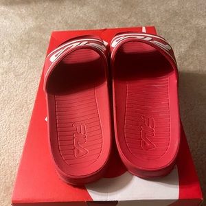 Im selling Red fila slides. Size 13. Red and White mixed.